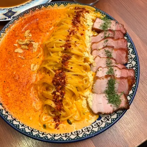 Rosé pasta served with thick pork belly slices from the Ikseon Chwihyang menu