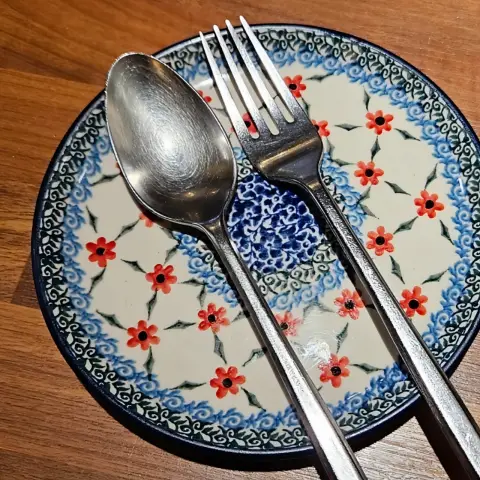 Floral patterned plate with fork and spoon at Ikseon Chwihyang