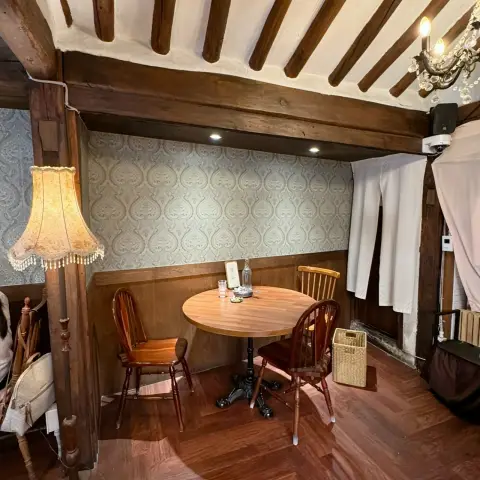 Warm and private seating area in hanok interior with chandelier lighting