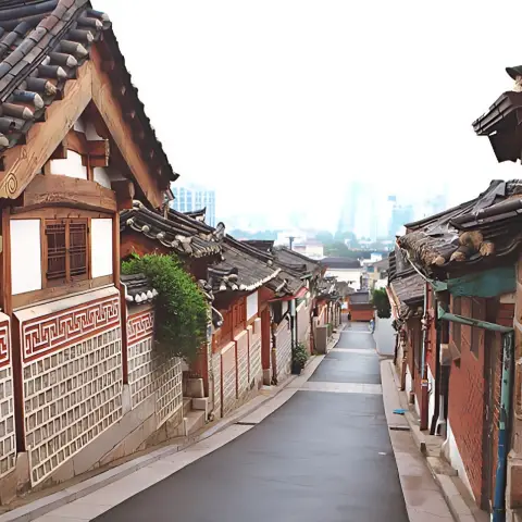 Traditional alley in ikseondong hanok village leading into the city
