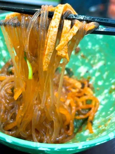 Visit Busan in 2025 – Spicy stir-fried glass noodles with fish cake from a local street food stall
