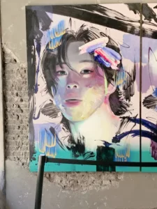Abstract and colorful painting of BTS Jimin on concrete-textured wall