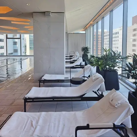 Lounge chairs beside the pool at Four Seasons Hotel Seoul