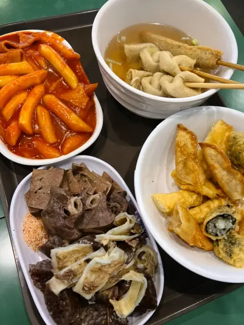 Tteokbokki, odeng, sundae, and twigim served together on one tray at Jopok Tteokbokki