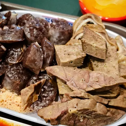 Generous platter of sundae and organ meats served at Jopok Tteokbokki