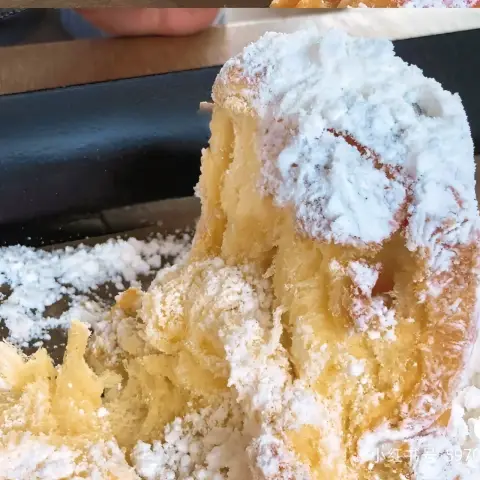 Pandoro from the cafe onion anguk menu torn open to reveal its fluffy, soft inside