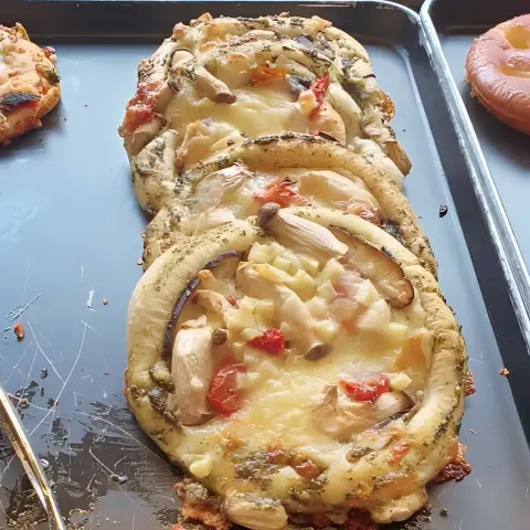 Cafe onion anguk menu includes this eggplant and cheese pizza bread full of savory flavor