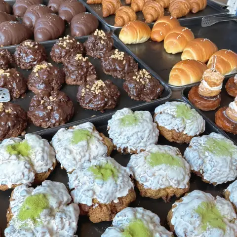 Cafe onion anguk menu variety including chocolate puffs, matcha buns, and croissants