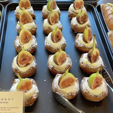 Sweet fig pastries topped with fresh fig halves at Cafe Onion Anguk