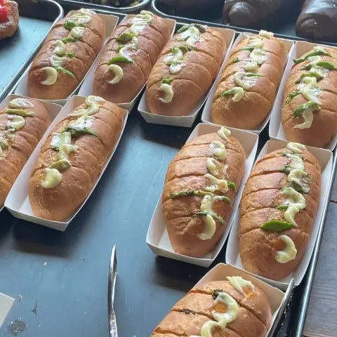Savory baguette topped with avocado slices and pollock roe
