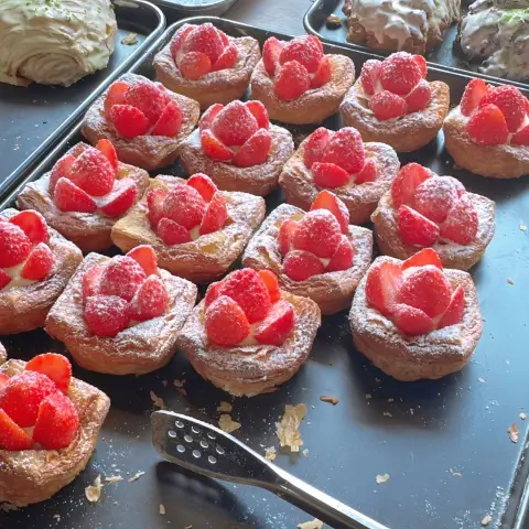 Strawberry cream pastries from the cafe onion anguk menu topped with fresh berries