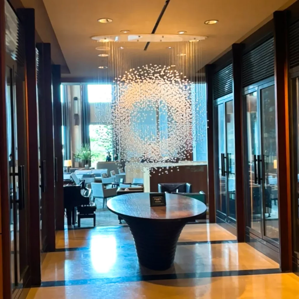 Elegant chandelier-style light art at The Shilla Seoul's hotel lounge
