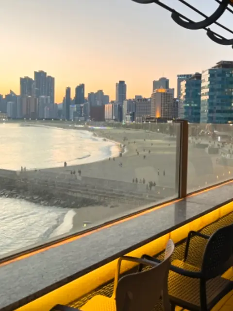 Sunset view of Haeundae Beach from Oase rooftop