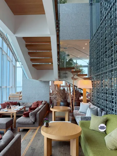 Park Hyatt Busan Dining Room lounge area with stylish stair and panoramic windows