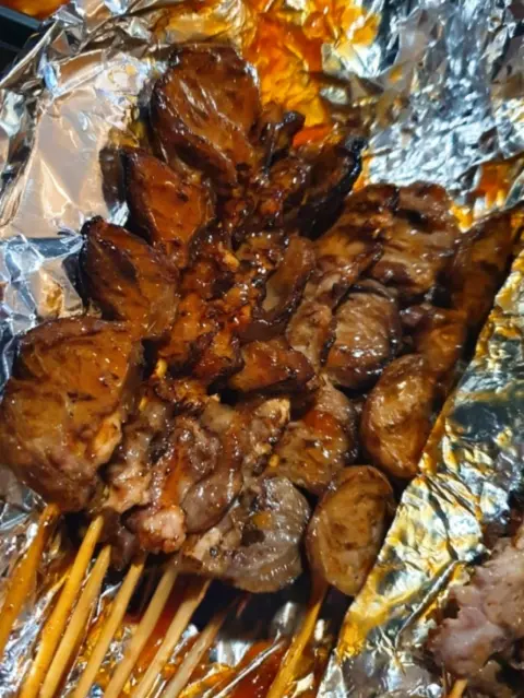 Grilled skewers with meat and sundae