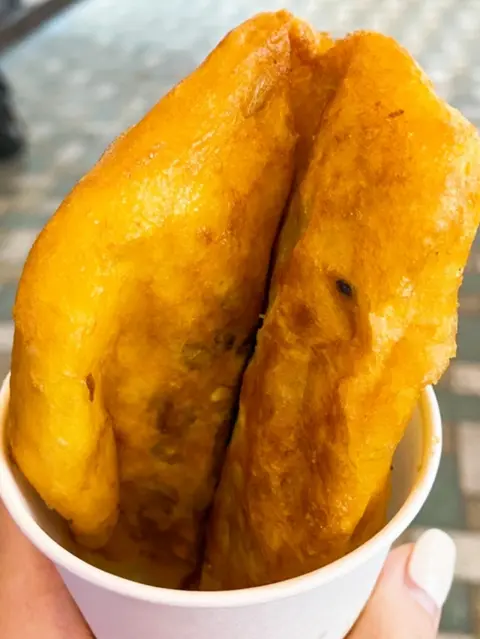Hotteok served in a paper cup