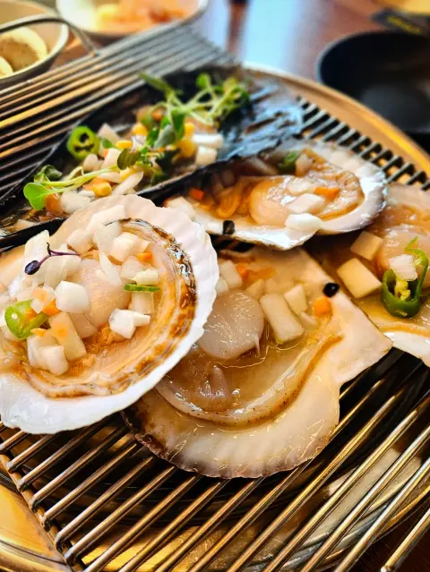 Grilled shellfish platter at a Cheongsapo restaurant