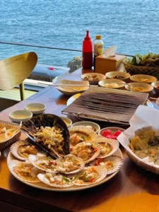 Table spread by the ocean at Haerim-ine Cheongsapo restaurant