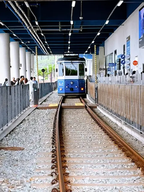Blue beach train arriving at the platform