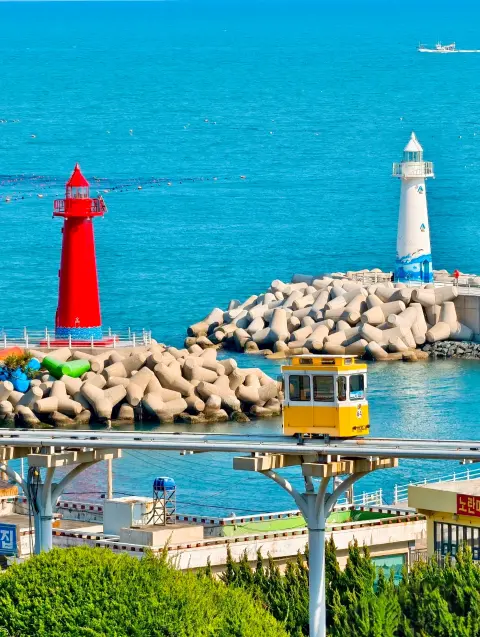 cheongsapo-red-white-lighthouses-capsule.webp Cheongsapo’s twin lighthouses and yellow Sky Capsule