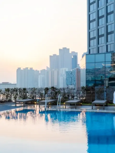 sunset reflections at paradise hotel busan’s outdoor pool