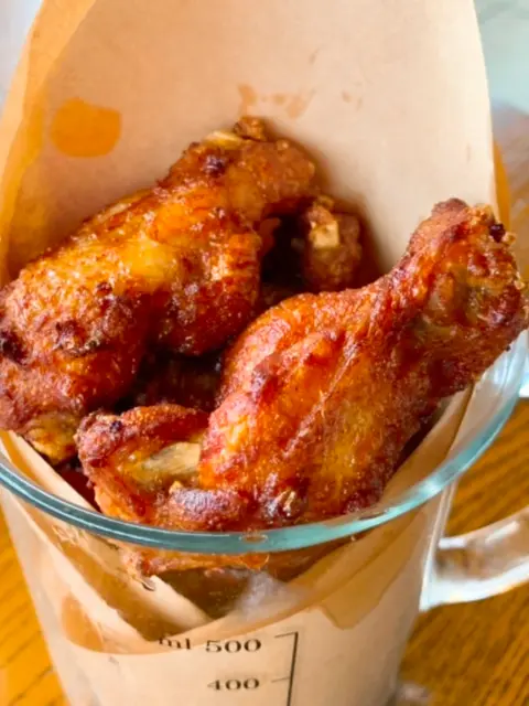 Close-up of golden fried chicken at Oase rooftop bar