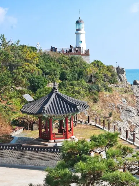 lighthouse and traditional pavilion dongbaek island