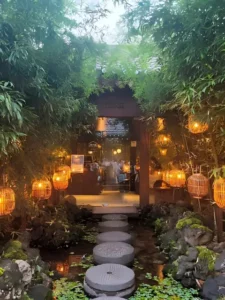 cheongsudang bamboo entrance with lanterns and stepping stones