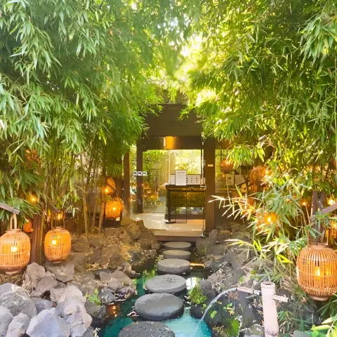bamboo-lined entrance pathway lit by soft morning sunlight