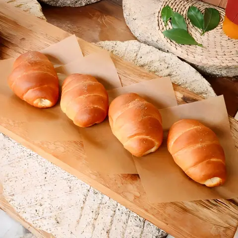 Four Jayeondo Salt Bread pieces on display in a hanok-inspired setting