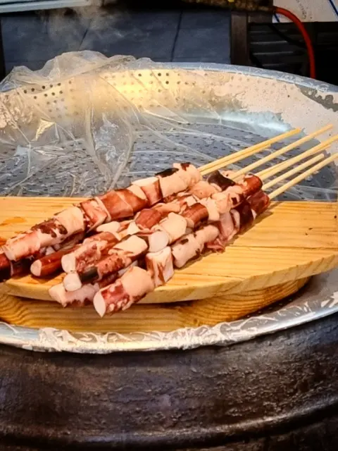 Grilled octopus skewers at Jeonju Hanok Village street market