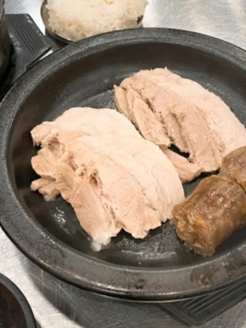 Subyeon Choego Dwaeji Gukbap suyuk and sundae set on black plate