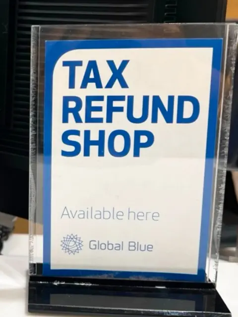Global Blue Tax Refund Shop sign at a Korean retail counter