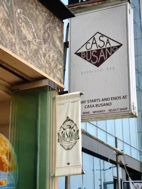 The signage of Casa Busano Gwangan invites visitors in with its signature phrase: "The day starts and ends at Casa Busano."