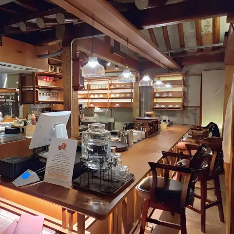 DongBaek Bakery’s open kitchen counter lined with teacups and café tools