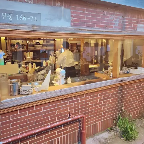 DongBaek Bakery’s open kitchen window facing the alley
