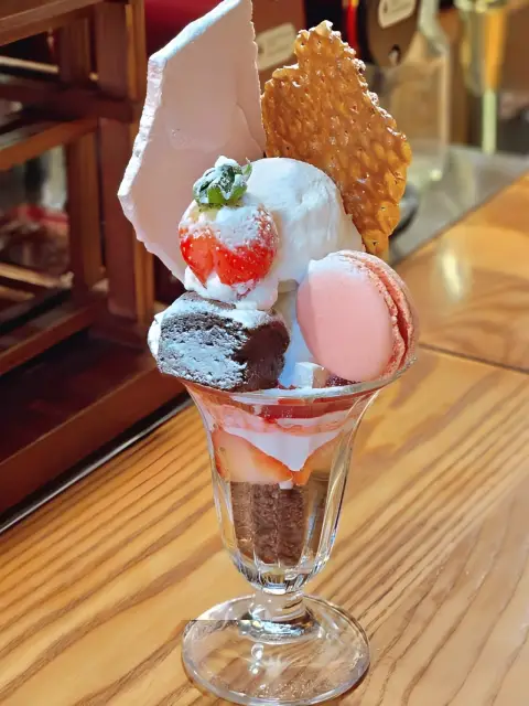 DongBaek Bakery parfait topped with macaron, brownie, strawberry, and ice cream