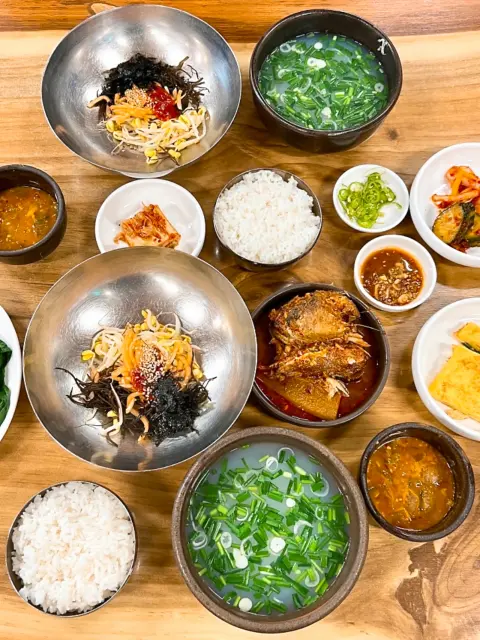 Another full table spread at Halmae Jaecheopguk with clam soup and bibimbap