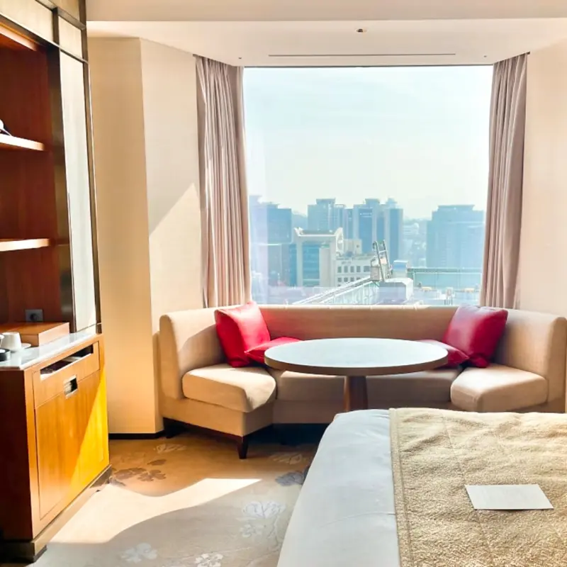 Seating area by the window in Lotte Hotel Seoul Review