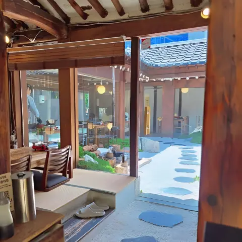 Tatami-style seating inside Oncheonjip’s hanok room