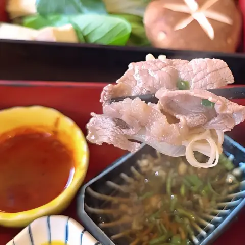 Tender beef slice dipped and ready at Oncheonjip