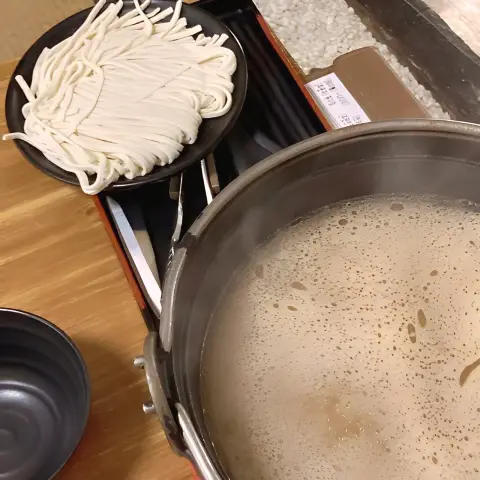 Udon noodles ready to be added to the hot broth