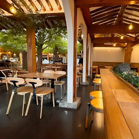 onjisim hanok seating area with arches and wooden tables