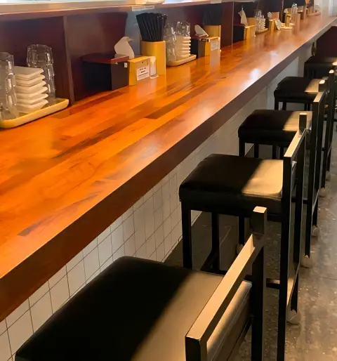 Counter seating area at Oreno Ramen Insa with utensils and napkins