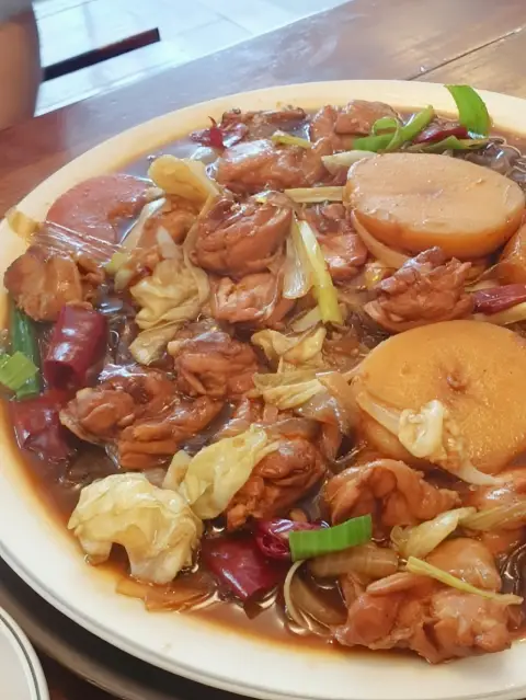 Boneless soy-braised chicken platter at Andong Jjimdak Myeongdong, served with vegetables and glass noodles