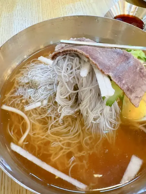 Gangnam Myeonok Insadong mul-naengmyeon served in a chilled beef and dongchimi broth