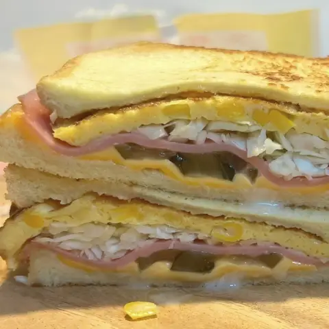 Isaac Toast Myeongdong Ham Special toast cross-section with egg, cheese, ham, and cabbage