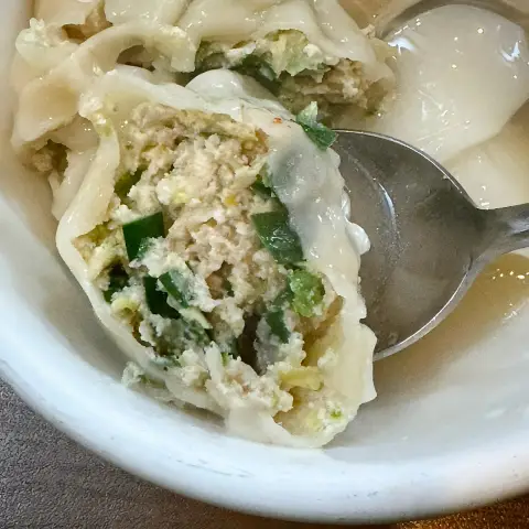 Gaeseong Mandu Koong pork dumpling filling with tofu and green onions