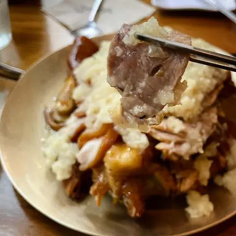 Tender pork slice lifted from garlic jokbal platter