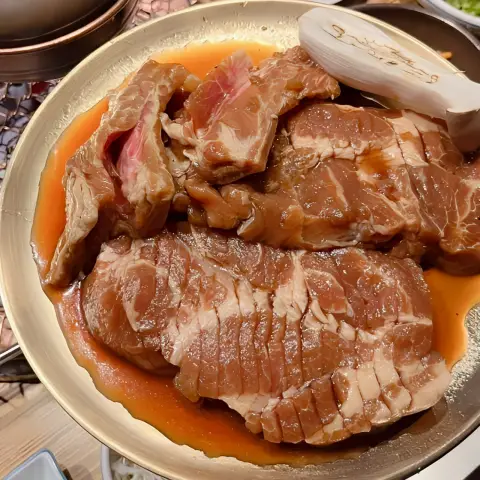 Plated pork cuts marinated in sweet soy sauce